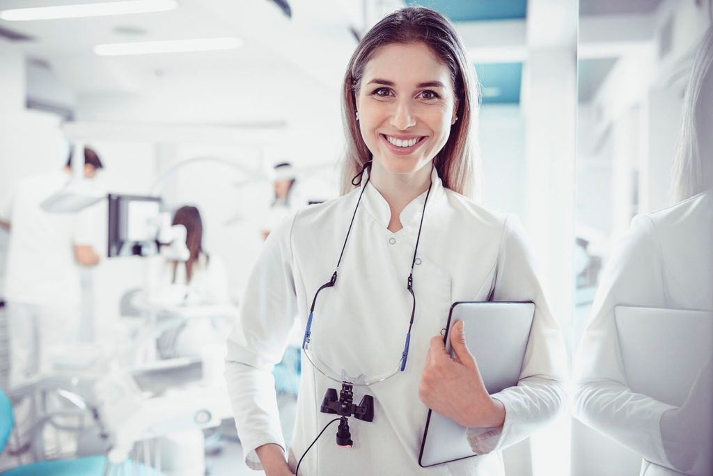 friendly dentist smiling in locally owned dental practice Timonium Maryland
